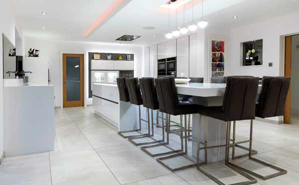 Bespoke kitchen design - White Schüller Kitchen with Corian Worktops, in Bury